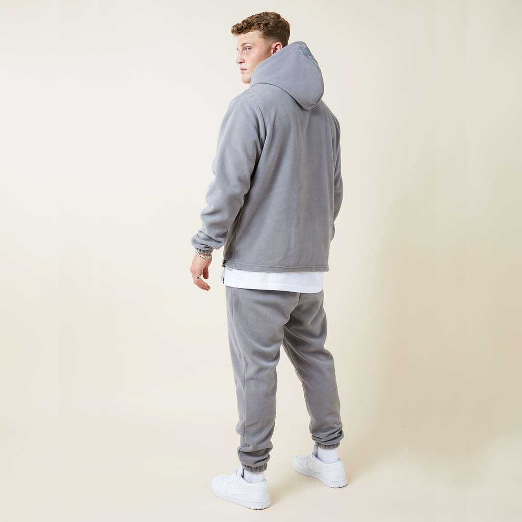 Model wearing polar hoodie and joggers