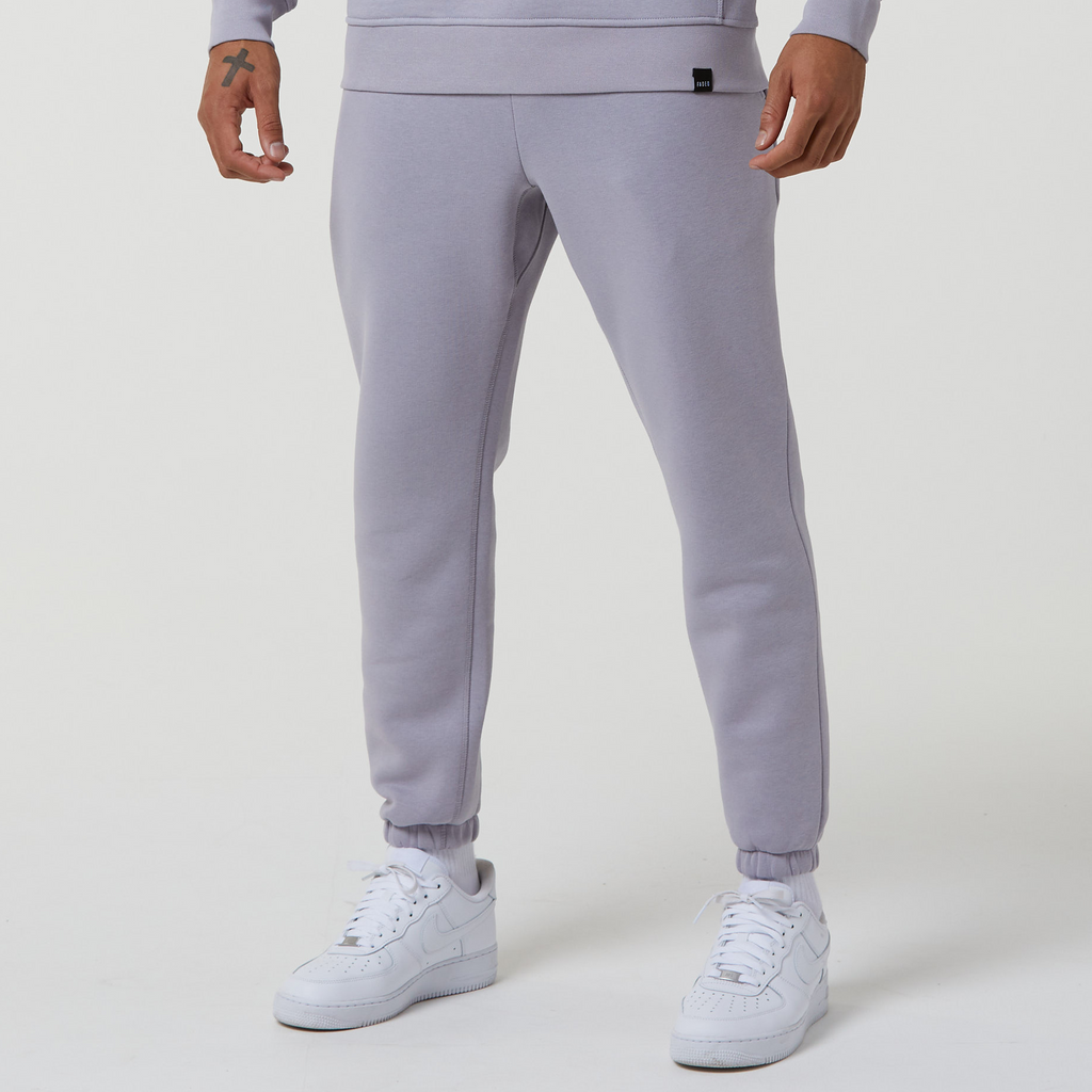 Male model wearing the Faded mens plain joggers in grey